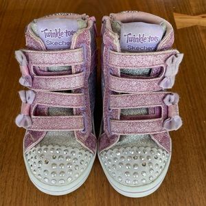 SKECHERS
Twinkle Toes Miss Holla Glam Light-Up High Top Sneakers.